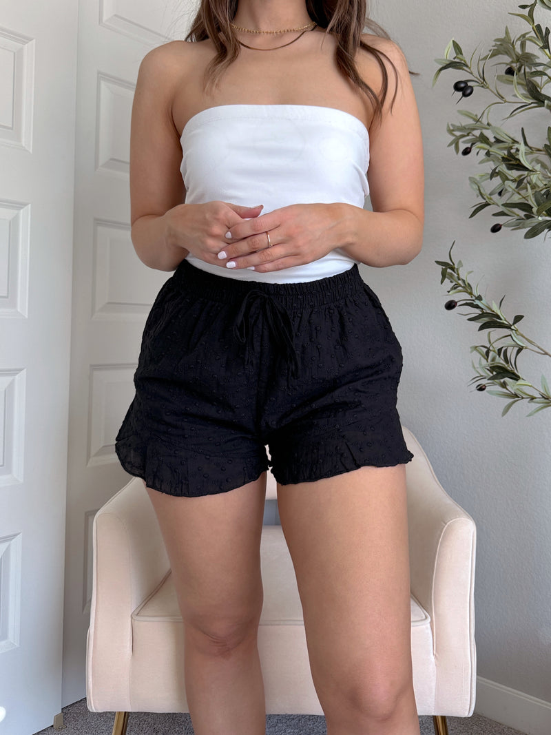 Maggie Eyelet Ruffle Hem Cotton Shorts (Black)