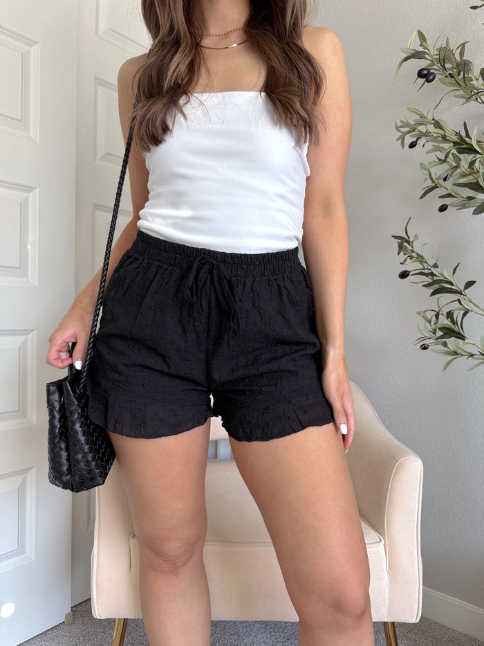 Maggie Eyelet Ruffle Hem Cotton Shorts (Black)