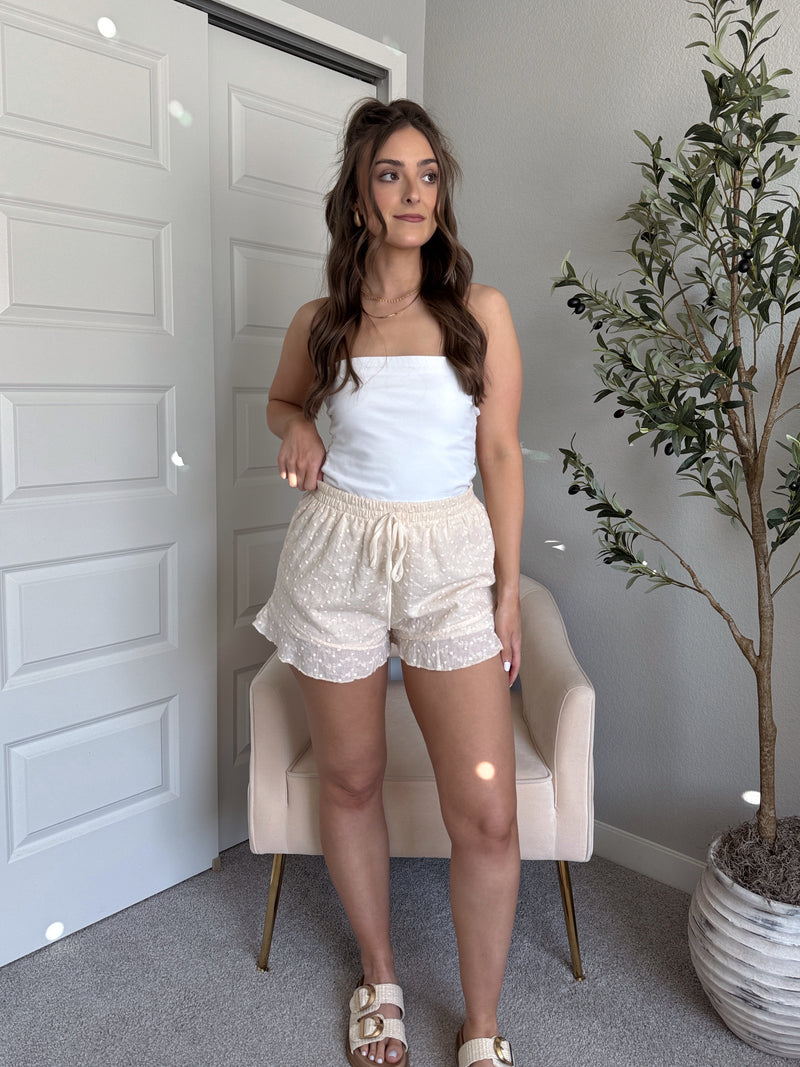 Maggie Eyelet Ruffle Hem Cotton Shorts (Light Sand)