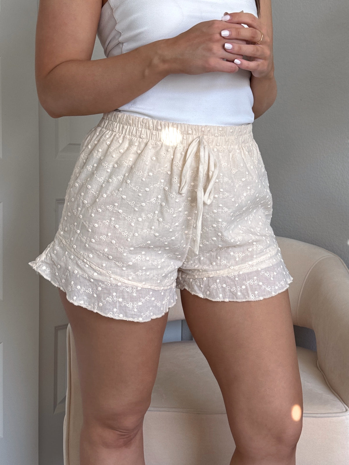 Maggie Eyelet Ruffle Hem Cotton Shorts (Light Sand)
