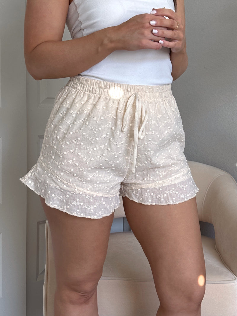 Maggie Eyelet Ruffle Hem Cotton Shorts (Light Sand)